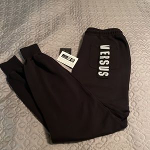 Versace black track pants with logo intarsia at rear pocket